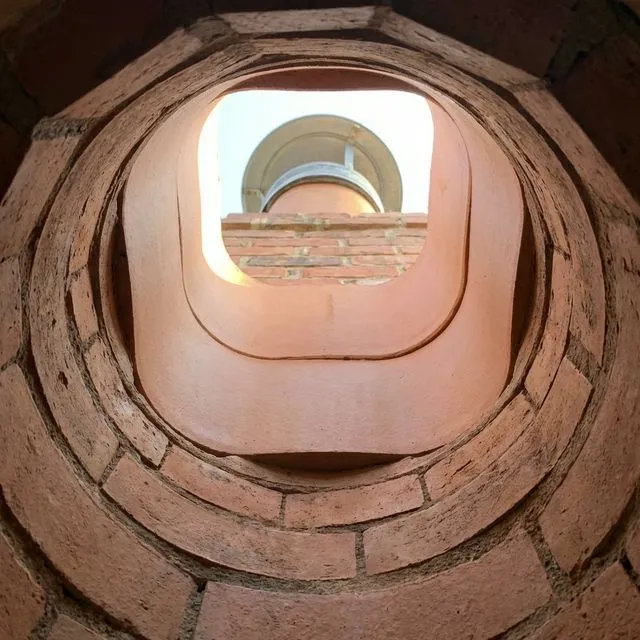 Clean chimney flue with pristine brick walls after professional cleaning